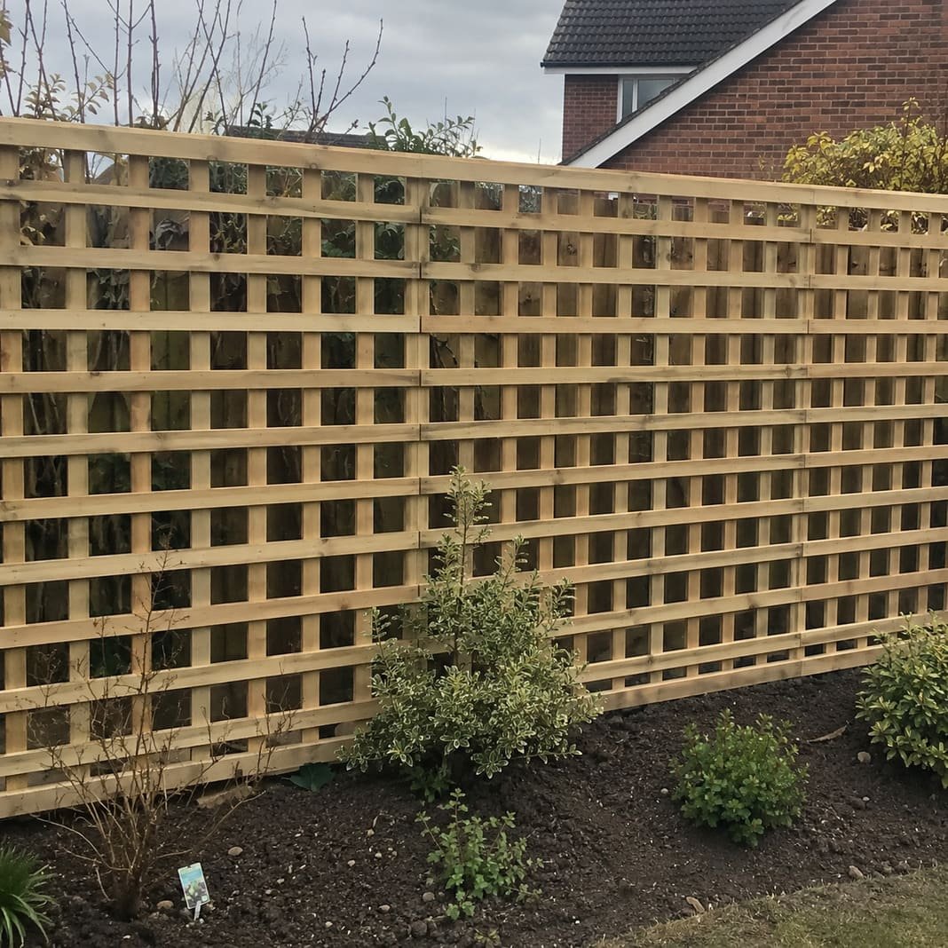 Garden trellis fitted above a fence for climbing plants.